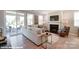 Cozy living room with a fireplace, plush seating, and sliding glass door offering a relaxing retreat at 9842 Quercus Ln, Huntersville, NC 28078