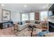 Bright and airy living room featuring a comfortable sectional couch, modern decor, and sliding door at 9842 Quercus Ln, Huntersville, NC 28078