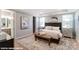 A serene bedroom with a neutral palette, carpeted floors, and lots of natural light from several windows at 9842 Quercus Ln, Huntersville, NC 28078
