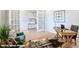 Stylish home office featuring a desk, jute rug, and ample natural light from French doors at 9842 Quercus Ln, Huntersville, NC 28078