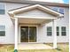 Covered back porch with sliding glass doors and exterior siding, perfect for outdoor enjoyment at 9934 Cask Way, Huntersville, NC 28078
