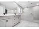 Bathroom with double sinks, marble shower, and custom cabinetry at 9934 Cask Way, Huntersville, NC 28078