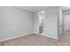 Bright, empty bedroom features hardwood floors and a door to a full bathroom at 9934 Cask Way, Huntersville, NC 28078