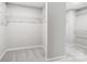 An organized walk-in closet with carpeted floor and wire shelving for efficient storage solutions at 9934 Cask Way, Huntersville, NC 28078