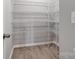 Walk in closet features multiple wire shelves and neutral paint at 9934 Cask Way, Huntersville, NC 28078