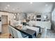 Open-concept dining room and living room combo with modern decor and lighting at 9934 Cask Way, Huntersville, NC 28078