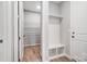 Mud room features a built in bench, cubbies, closet and wood-look floors at 9934 Cask Way, Huntersville, NC 28078