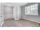 Bright office with French doors, white trim, and a large window at 9934 Cask Way, Huntersville, NC 28078