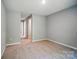 Neutral bedroom features carpet and a walk-through to a hallway at 9957 Cask Way, Huntersville, NC 28078