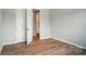 Bedroom with a neutral color scheme and hardwood floors at 9957 Cask Way, Huntersville, NC 28078