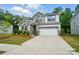 Beautiful two-story home with modern architecture, manicured lawn and a two car garage at 9957 Cask Way, Huntersville, NC 28078