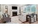 Living room with fireplace, large windows, comfortable seating, and stylish decor create a relaxing atmosphere at 9957 Cask Way, Huntersville, NC 28078