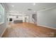 Open concept living room and kitchen area, featuring modern lighting and ample space for entertaining at 9957 Cask Way, Huntersville, NC 28078
