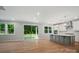 Open concept living space with modern kitchen, stainless appliances and sliding glass doors at 9957 Cask Way, Huntersville, NC 28078