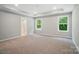 Bright and airy main bedroom with tray ceiling, complemented by windows and an en-suite bath at 9957 Cask Way, Huntersville, NC 28078
