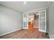Bright room with open french doors leading to staircase and kitchen at 9957 Cask Way, Huntersville, NC 28078