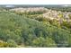 A private wooded lot close to community and pond, perfect for building a dream home at 10835A Wildlife Rd, Charlotte, NC 28278