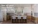 Modern kitchen with stainless steel appliances, white cabinets, and hardwood floors at 10835A Wildlife Rd, Charlotte, NC 28278