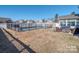 Large fenced-in backyard with an in-ground pool and patio seating at 12848 Mustang Dr, Midland, NC 28107