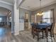 Cozy dining room with stylish lighting, wainscoting detail, and an open layout, great for Gathering meals at 12848 Mustang Dr, Midland, NC 28107