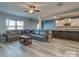 Open-concept living room with stylish seating, modern flooring, and an inviting atmosphere at 12848 Mustang Dr, Midland, NC 28107