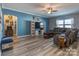 Comfortable living room with large windows, stylish furniture, and sleek flooring, creating a welcoming atmosphere at 12848 Mustang Dr, Midland, NC 28107