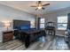 Serene bedroom with neutral walls, a comfortable bed, and natural light from the windows at 12848 Mustang Dr, Midland, NC 28107