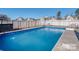 Backyard pool offers a refreshing escape, surrounded by a fenced yard and a patio area for lounging at 12848 Mustang Dr, Midland, NC 28107