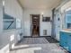 Enclosed sunroom with white walls and floor and a TV at 12848 Mustang Dr, Midland, NC 28107