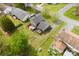 Aerial view of house with grey roof and two wooden decks in grassy fenced backyard at 1308 Gaston Way, Dallas, NC 28034