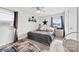 Comfortable bedroom with natural light, complemented by a ceiling fan and soft decor for relaxation at 1308 Gaston Way, Dallas, NC 28034