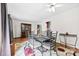 Dining room featuring hardwood floors, a china cabinet, a modern table set, and an adjacent kitchen view at 1308 Gaston Way, Dallas, NC 28034