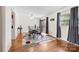 Open dining room with hardwood floors, a stylish table set, and a sliding door leading to an outdoor area at 1308 Gaston Way, Dallas, NC 28034