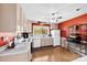Functional kitchen featuring bright cabinets, white appliances, ample counter space, and hardwood flooring at 1308 Gaston Way, Dallas, NC 28034