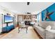 Cozy living room with a brick fireplace, comfortable seating, and an entertainment center for a relaxed atmosphere at 1308 Gaston Way, Dallas, NC 28034