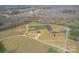 Expansive aerial view of a home's location on a sprawling, partially wooded lot, complete with a tranquil pond at 154 Carters Farm Dr, Statesville, NC 28625