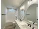 Bathroom featuring double sink vanity and tub shower combo with tile surround at 154 Carters Farm Dr, Statesville, NC 28625