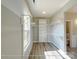 Spacious walk-in closet with custom shelving and natural light from the window at 154 Carters Farm Dr, Statesville, NC 28625