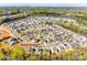 Wide aerial view of a residential area with neatly arranged houses and tree-lined streets at 1929 Shorthorn St, Charlotte, NC 28213