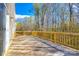 Spacious wooden deck perfect for outdoor gatherings with mature trees in the background at 1929 Shorthorn St, Charlotte, NC 28213