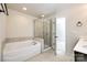 Bathroom featuring soaking tub, glass shower, and tile accents for a spa-like experience at 1929 Shorthorn St, Charlotte, NC 28213