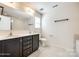 Bright bathroom featuring double vanity, tile floors, toilet, and large mirror for a fresh and inviting space at 1929 Shorthorn St, Charlotte, NC 28213