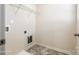 Functional laundry room with overhead shelving and utility connections, ready for appliances at 1929 Shorthorn St, Charlotte, NC 28213
