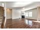 Bright, open living room features hardwood floors and fireplace, perfect for gatherings at 1929 Shorthorn St, Charlotte, NC 28213