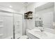 Bright bathroom with a glass shower, shelving, and vanity with mirror at 2027 Redstone Dr, York, SC 29745