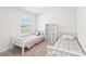 Bright bedroom with two twin beds, a window for natural light, and closet space at 2027 Redstone Dr, York, SC 29745