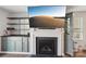 Modern fireplace design with custom shelving and TV for a cozy and stylish living space at 2027 Redstone Dr, York, SC 29745