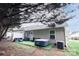 Private backyard with lush greenery, outdoor seating, and a relaxing hot tub at 222 Baldwin Ct, Rock Hill, SC 29730