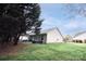 Lovely backyard with green lawn and trees provides privacy and space for outdoor enjoyment at 222 Baldwin Ct, Rock Hill, SC 29730