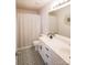 Bathroom featuring double sinks, vanity, modern tile flooring, and large mirror at 222 Baldwin Ct, Rock Hill, SC 29730